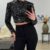 Glitter top met lange mouwen zwart